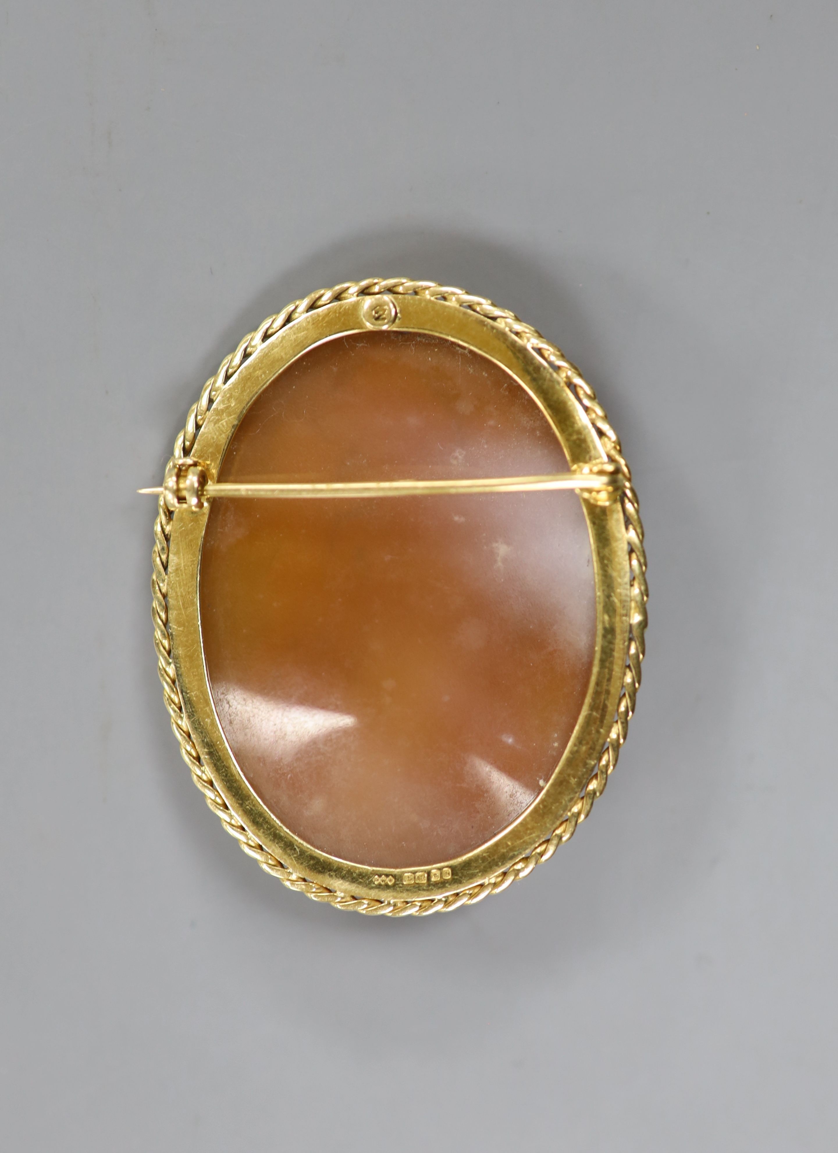 A 1970's 18ct gold mounted oval cameo shell, carved with Europa and the Bull, 53mm, gross 20.4 grams.